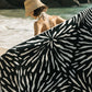 Ruby Mint Remington black and white floral stripe towel worn on the beach