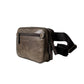Brown leather waist bag on a white pedestal with a light gray background
