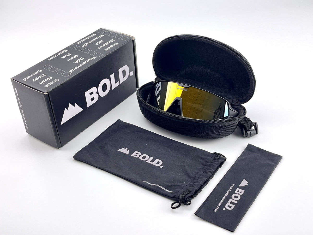 BOLD Shadows wrap sunglasses in gold with the BOLD box, zip case and cleaning pouch