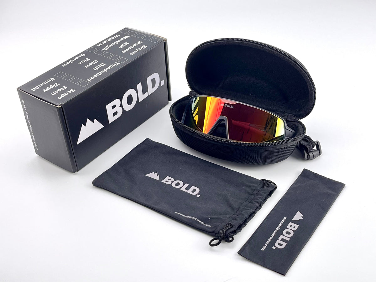 BOLD Shadows wrap sunglasses in red and black with the BOLD box, zip case and cleaning pouch