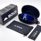 BOLD Shadows wrap sunglasses in blue and yellow with the BOLD box, zip case and cleaning pouch