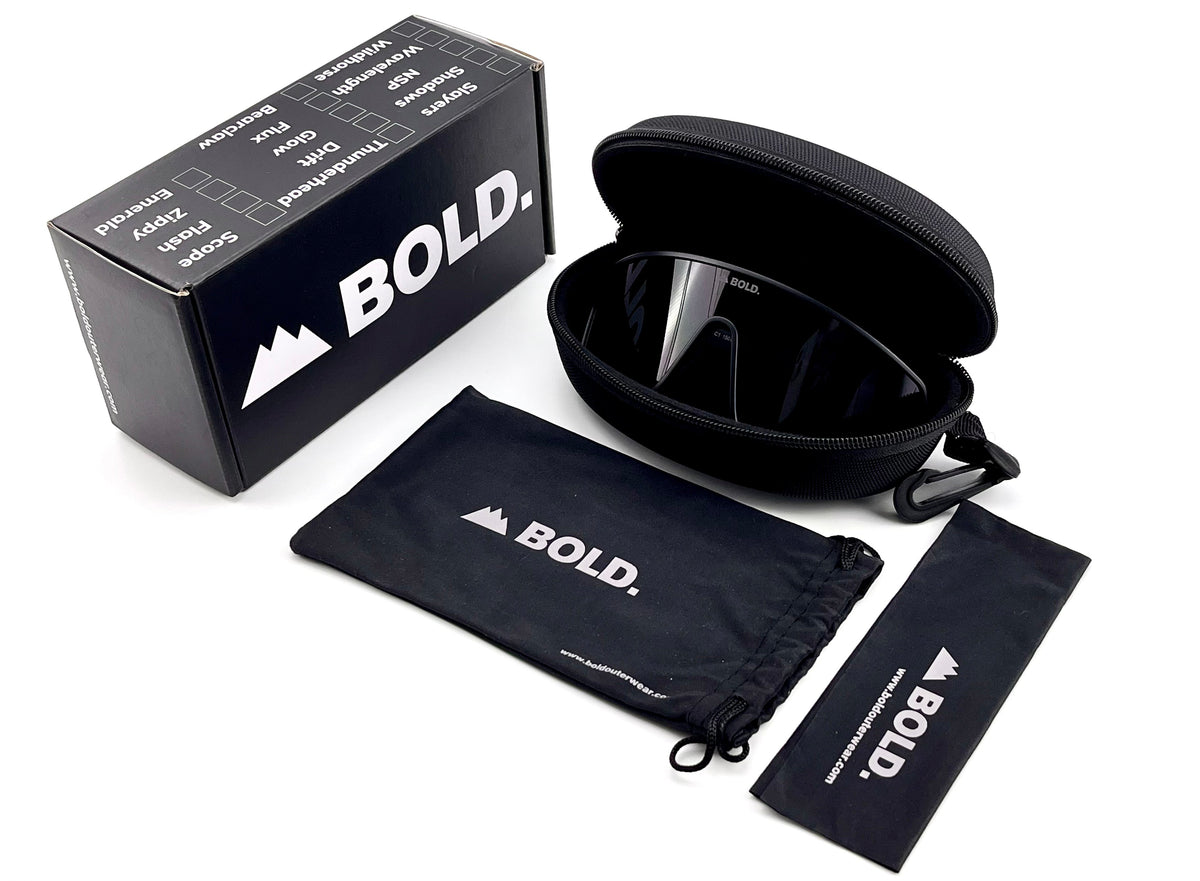 BOLD NSP low-profile sunglasses in black with the BOLD box, zip case and cleaning pouch