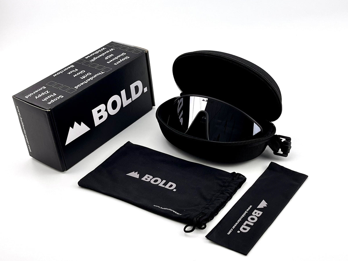 BOLD NSP low-profile sunglasses in gray with the BOLD box, zip case and cleaning pouch