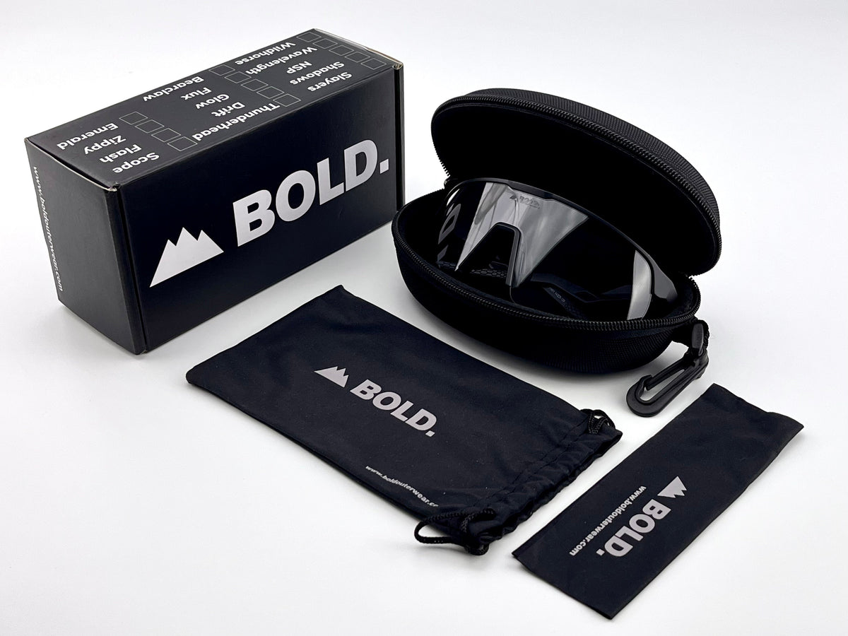 BOLD Flash photochromic sunglasses in black with the BOLD box, zip case and cleaning pouch