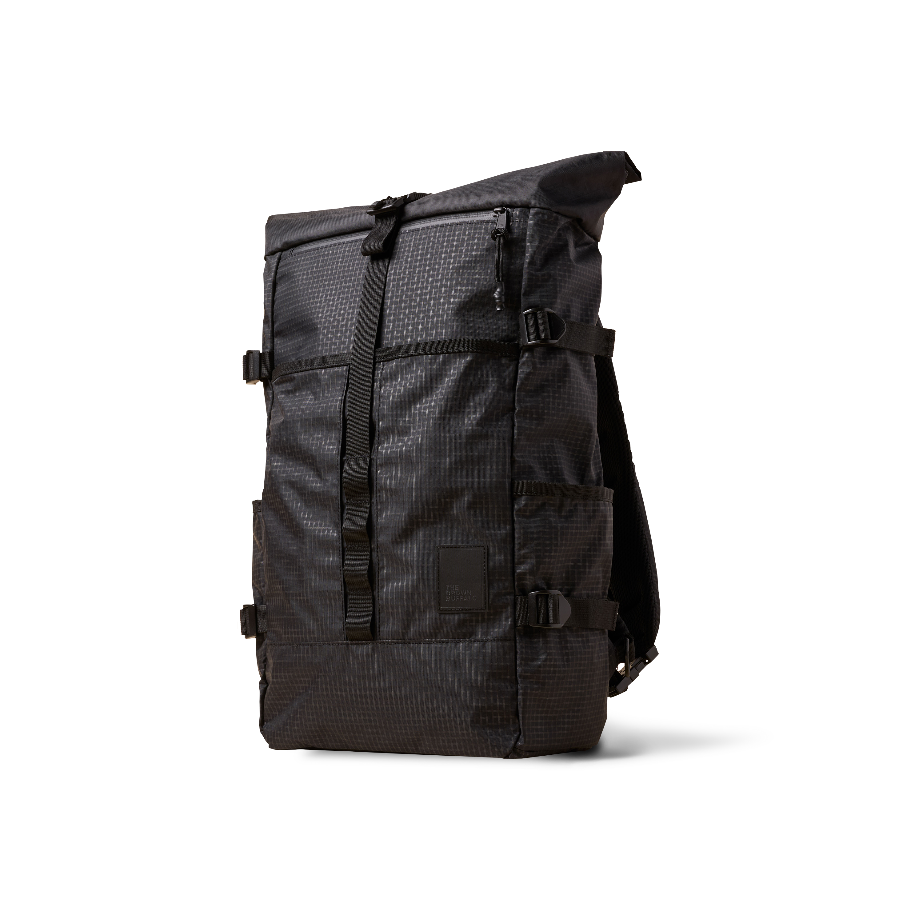 The Brown Buffalo Rolltop roll top backpack in Black Grid
