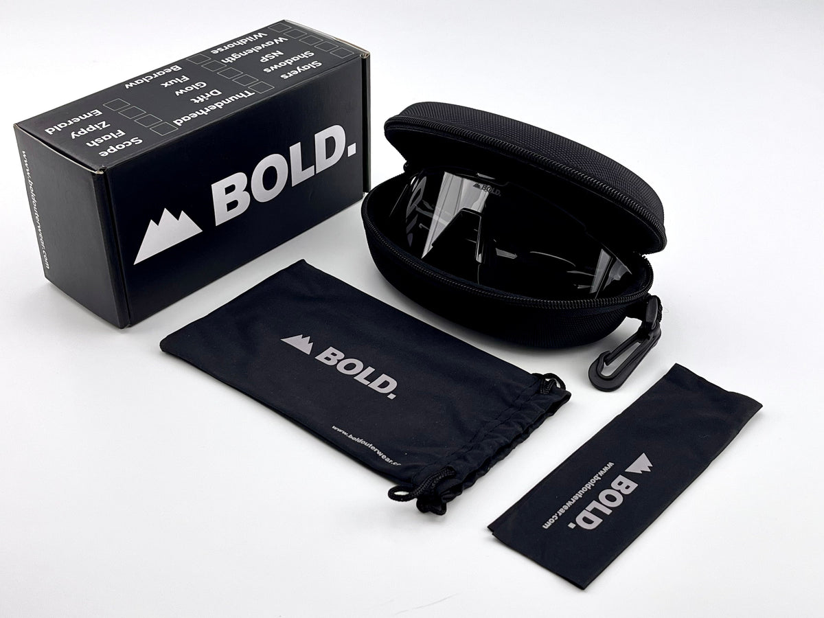BOLD Wavelength photochromic shield sunglasses in black with the BOLD box, zip case and cleaning pouch