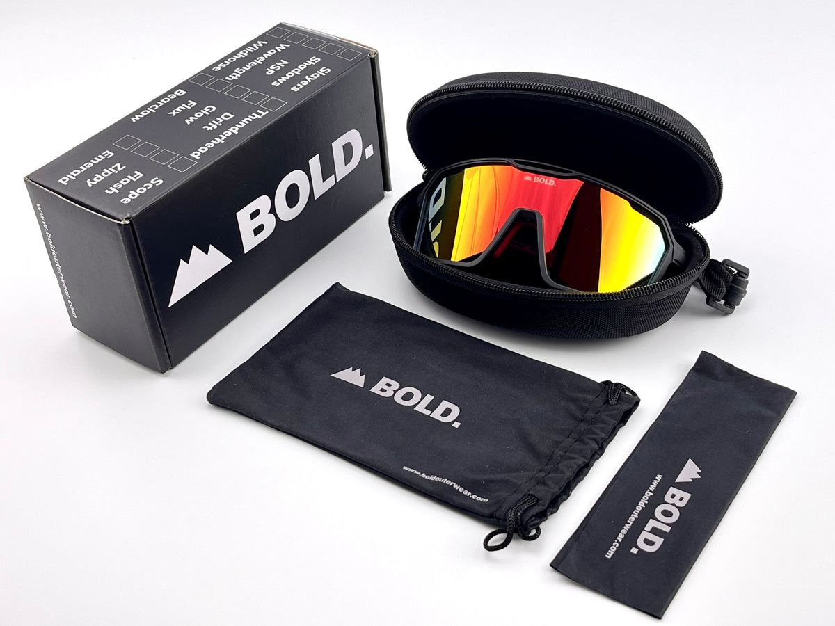 BOLD Flux wrap sunglasses in red and black with the BOLD box, zip case and cleaning pouch