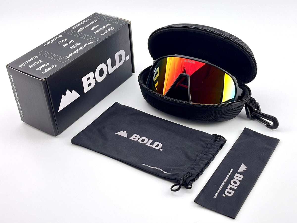 BOLD Slayers oversized sunglasses in red and black with the BOLD box, zip case and cleaning pouch