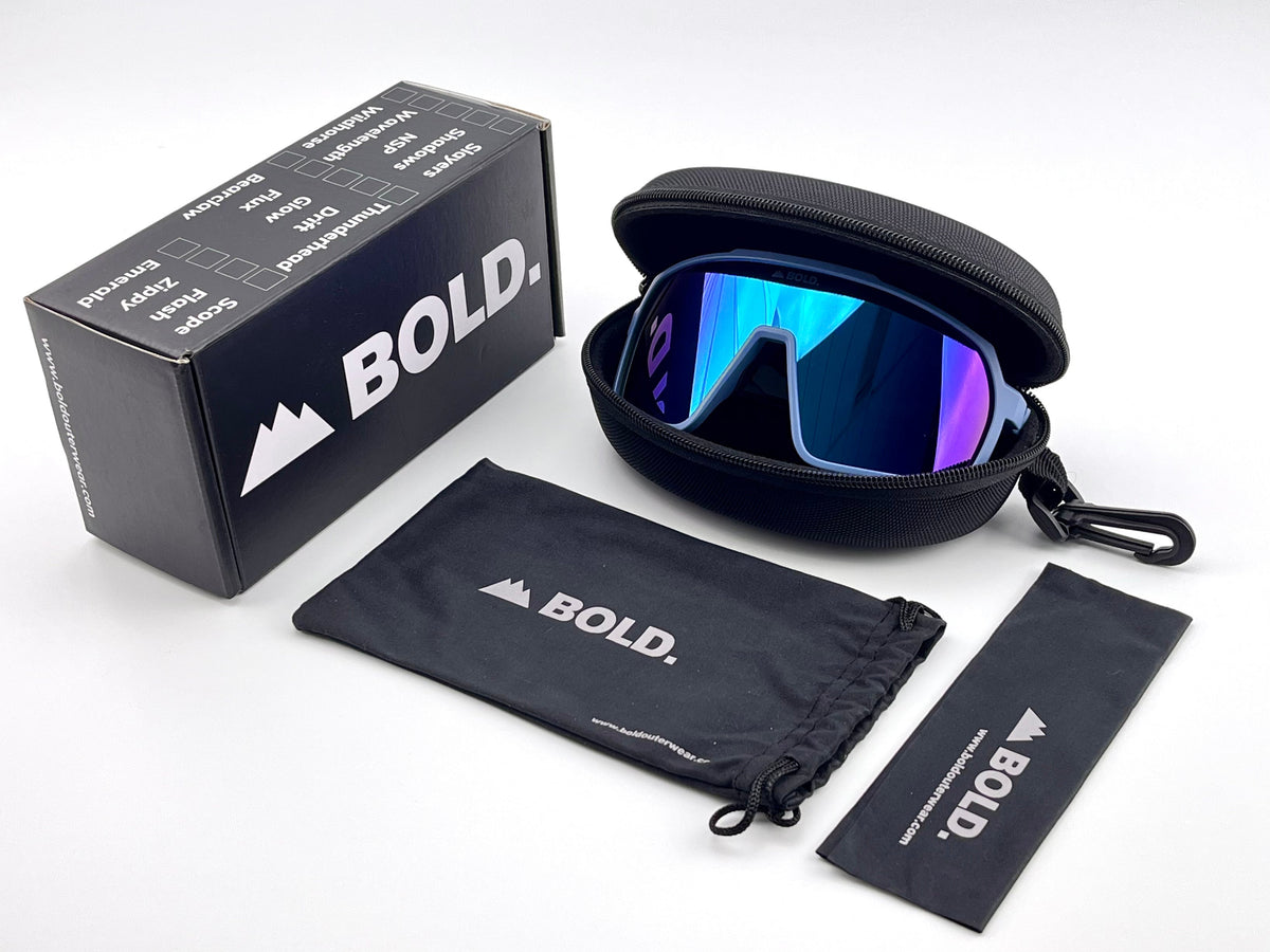 BOLD Slayers oversized sunglasses in blue with the BOLD box, zip case and cleaning pouch