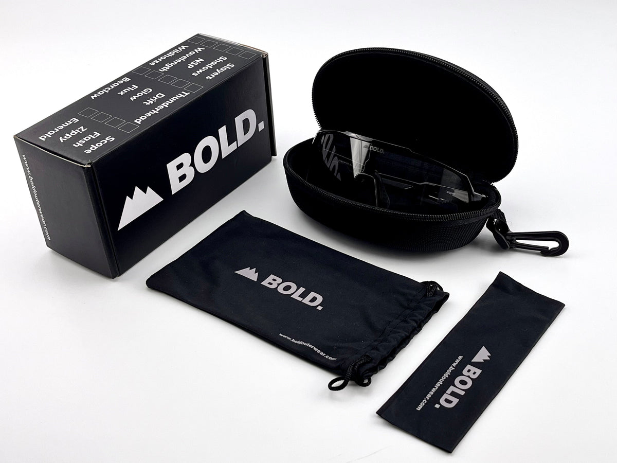BOLD Slayers oversized photochromic sunglasses in black with the BOLD box, zip case and cleaning pouch