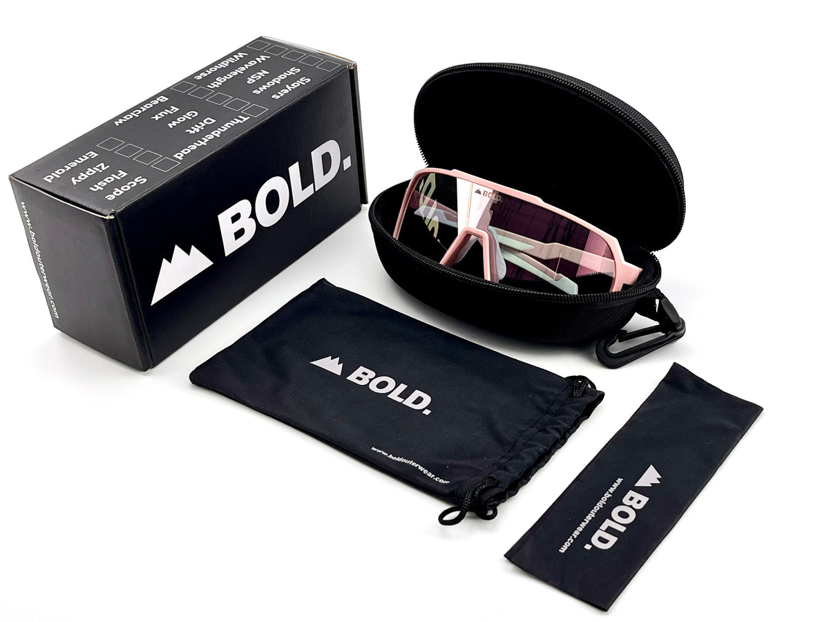 BOLD Slayers oversized photochromic sunglasses in pink with the BOLD box, zip case and cleaning pouch