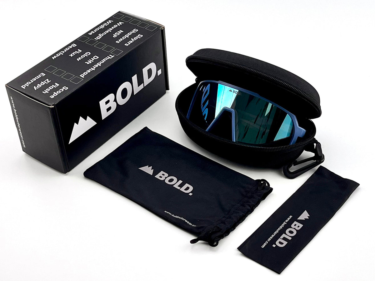 BOLD Slayers oversized photochromic sunglasses in blue with the BOLD box, zip case and cleaning pouch