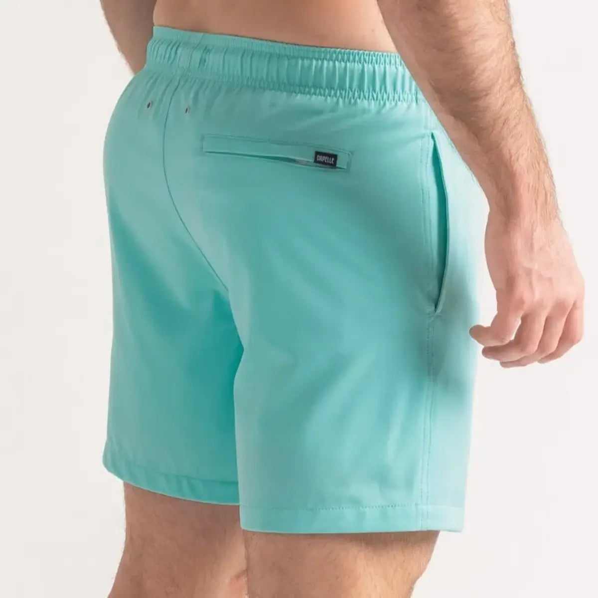 Aqua Blue men's hybrid swim short in solid aqua mint, back view