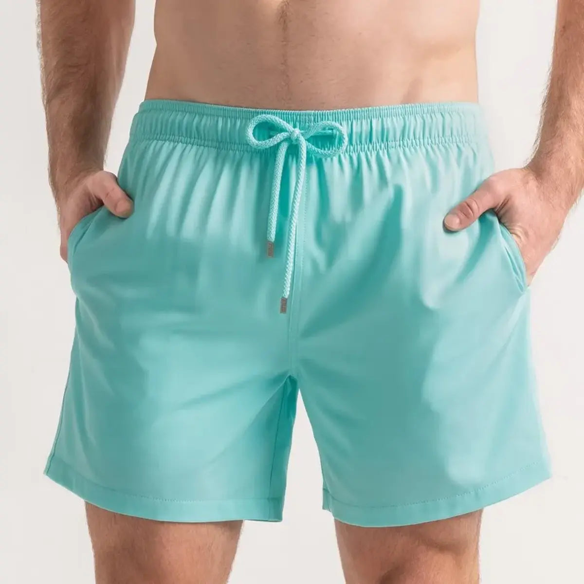Aqua Blue men's hybrid swim short in solid aqua mint, front view, second angle