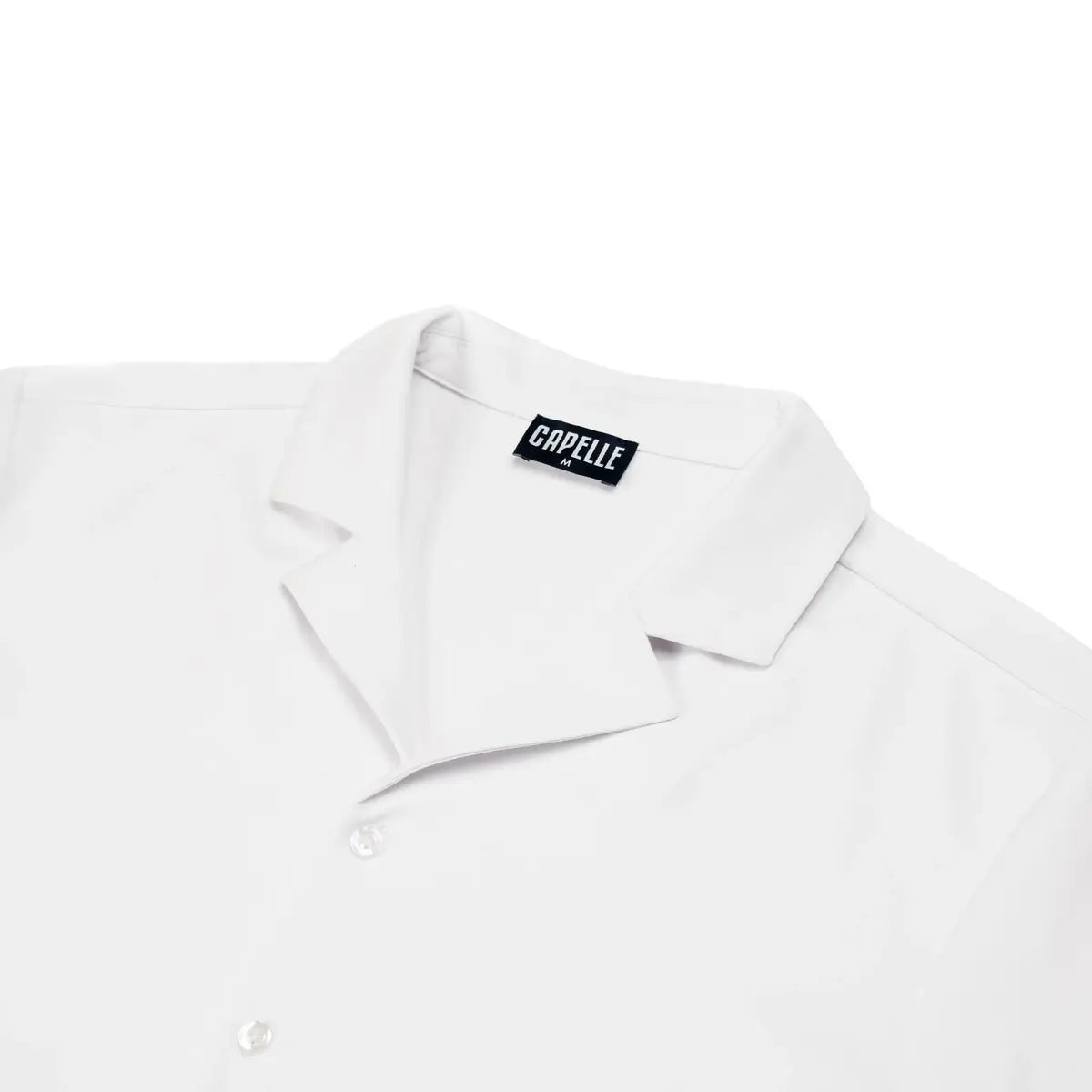 Close-up of the Arctic White resort shirt fabric and button placket in white