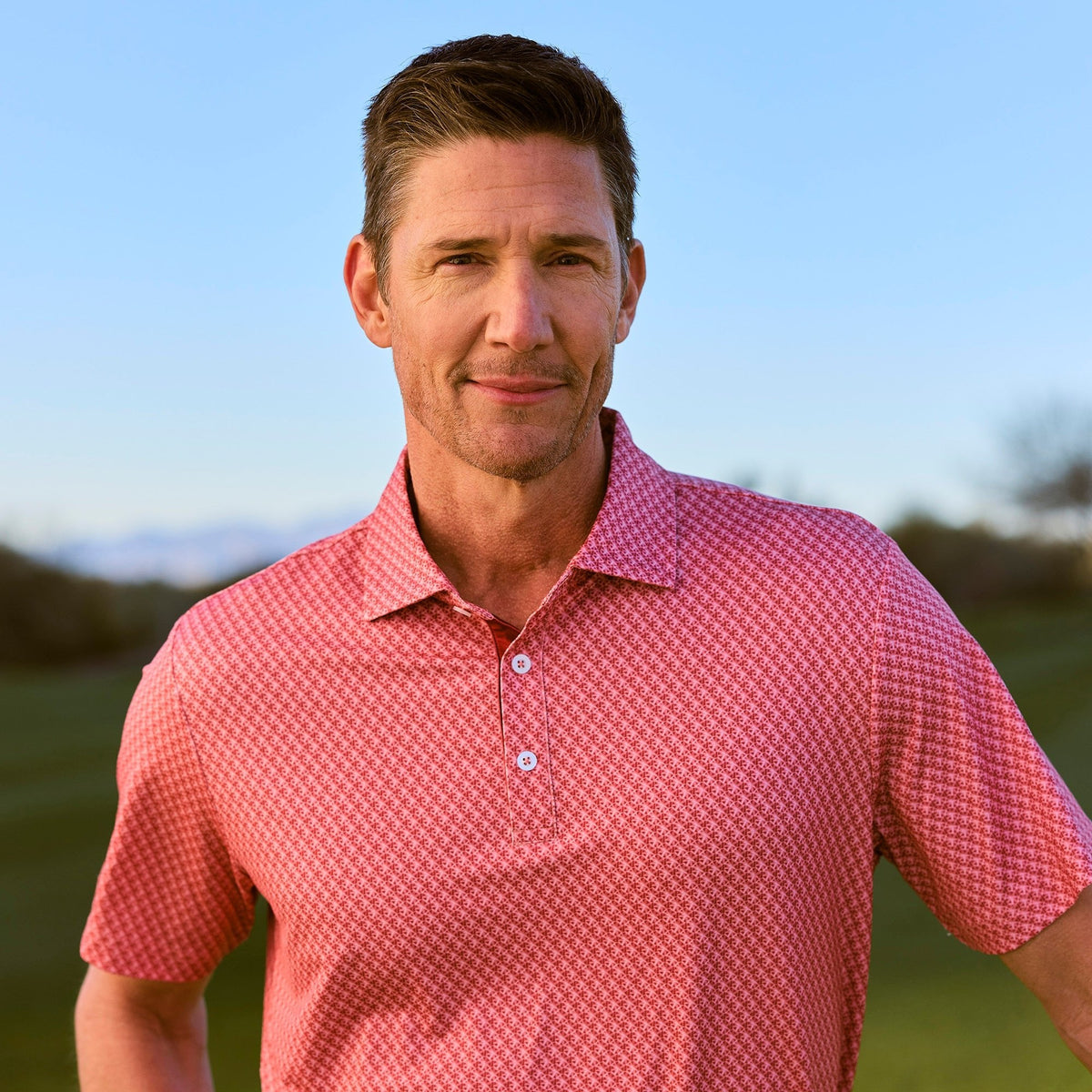 Greatness Wins Athletic Tech Printed Polo in Faded Red Blur