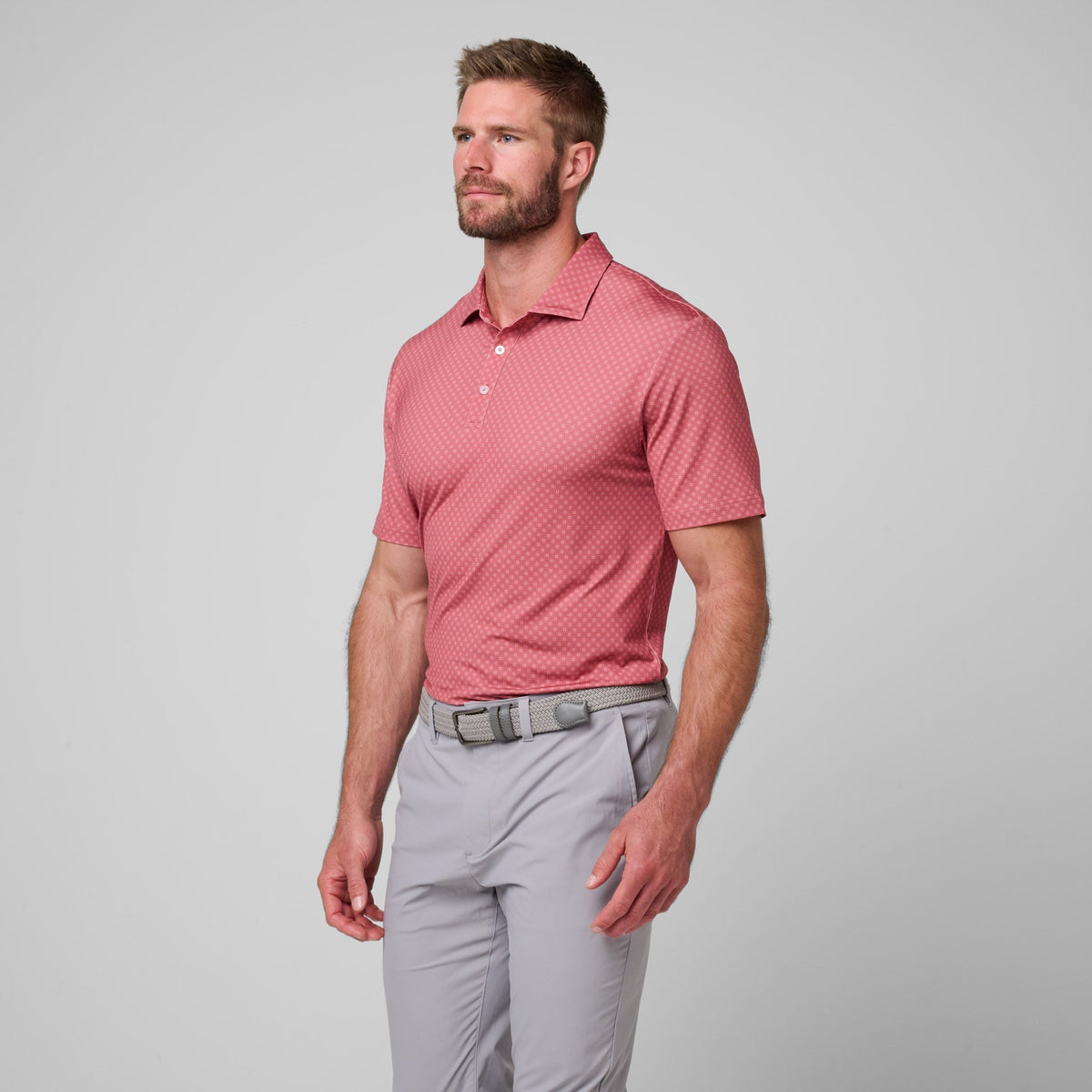 Greatness Wins Athletic Tech Printed Polo in Faded Red Geo