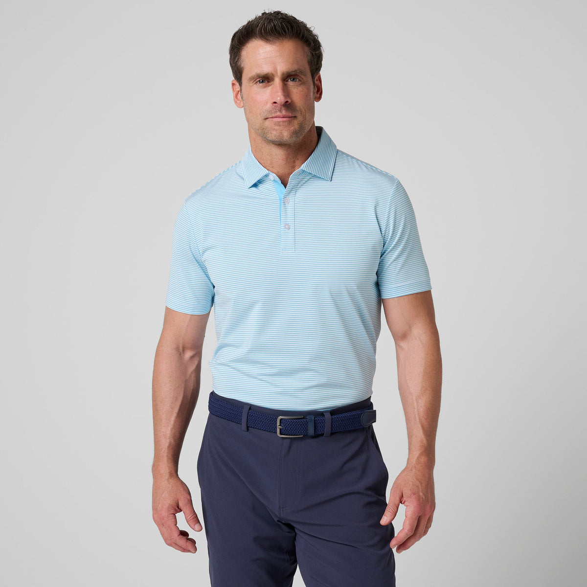 Greatness Wins Athletic Tech Stripe Polo in Carolina Blue and White