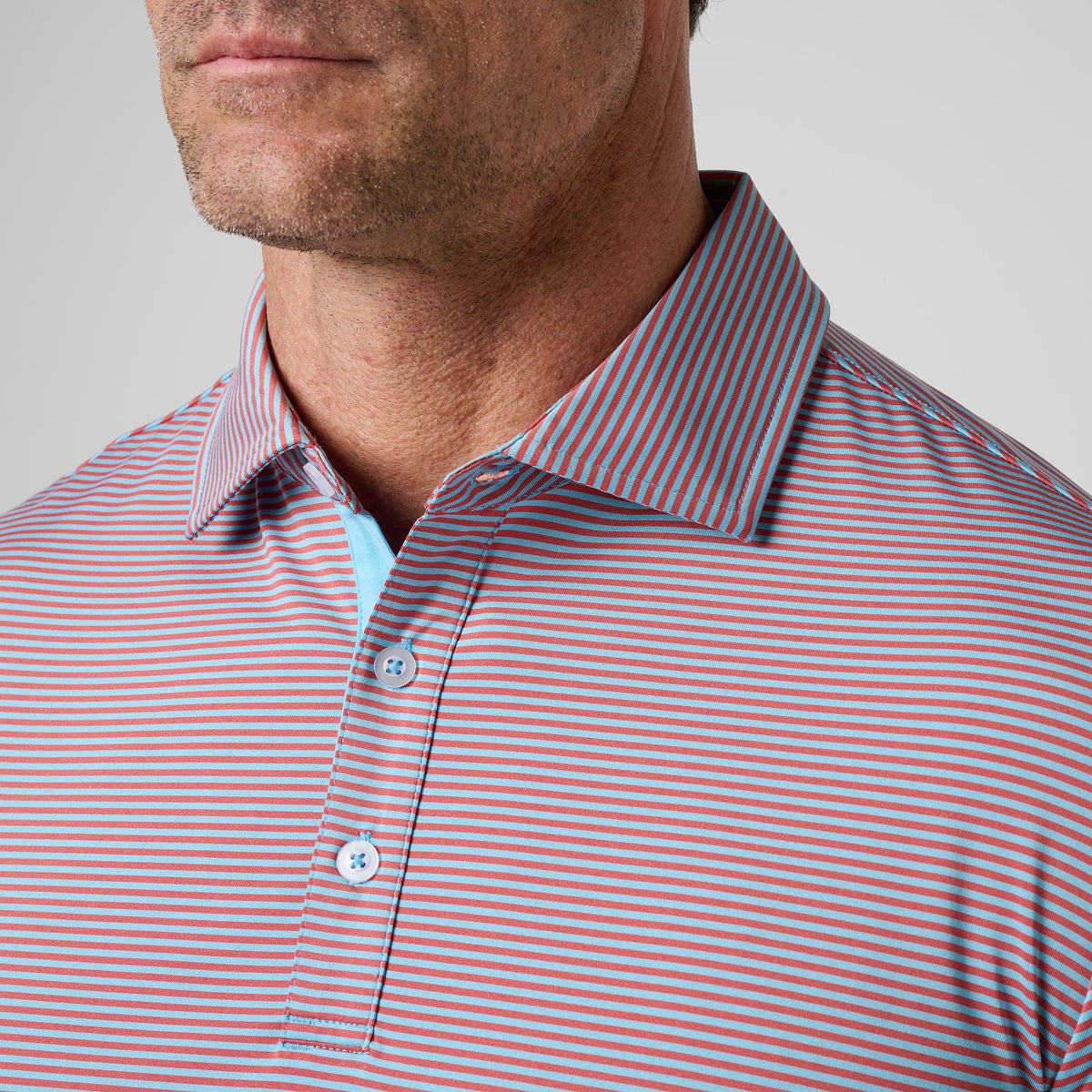 Greatness Wins Athletic Tech Stripe Polo in Faded Red and Carolina Blue, view 2