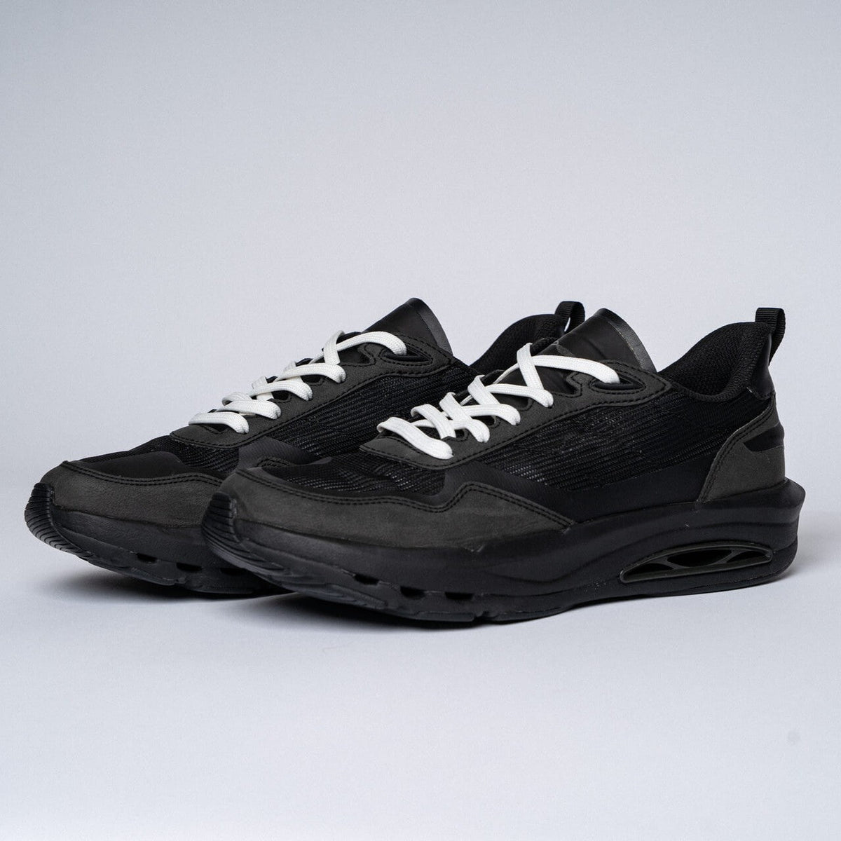 CDNCE Coastal Trainer in All Black, pair view