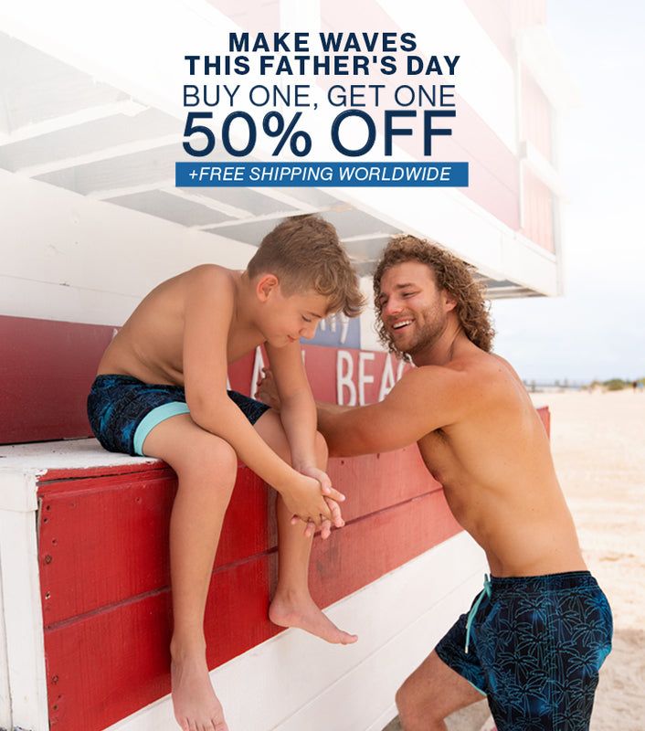 make waves this father's day. buy one, get one 50% off for a limited time plus free shipping worldwide. image shows dad and kid sitting both wearing the same swim trunks.