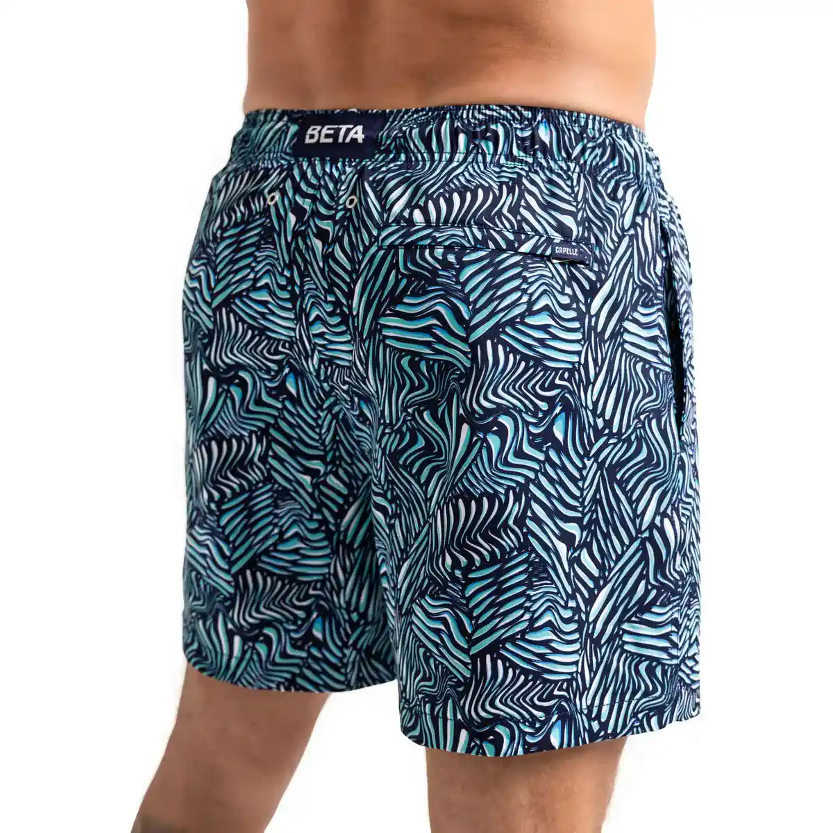 Beta Blue men's hybrid swim short in navy with an aqua and white leaf print, back view