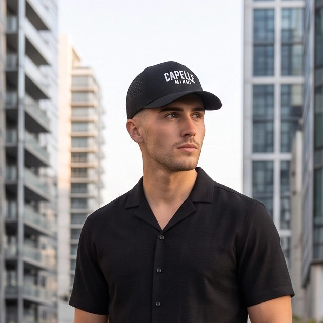 Black Onyx Laser Luxe Performance Snapback Hat worn front on, structured crown, Capelle Miami