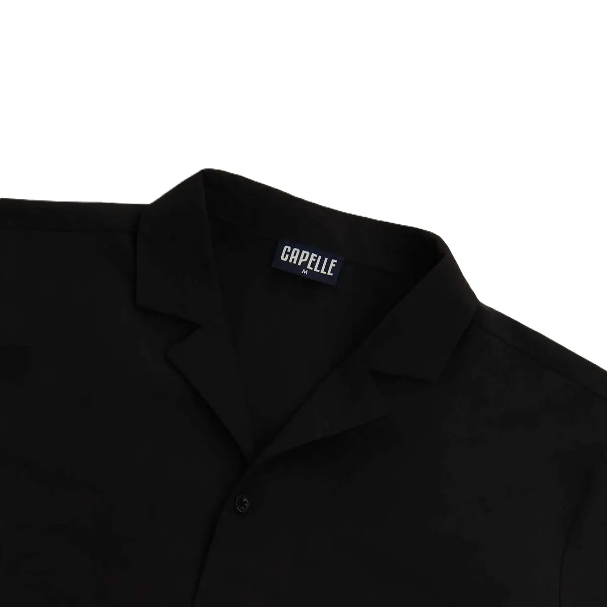Close-up of the Black Onyx resort shirt fabric and button placket in black