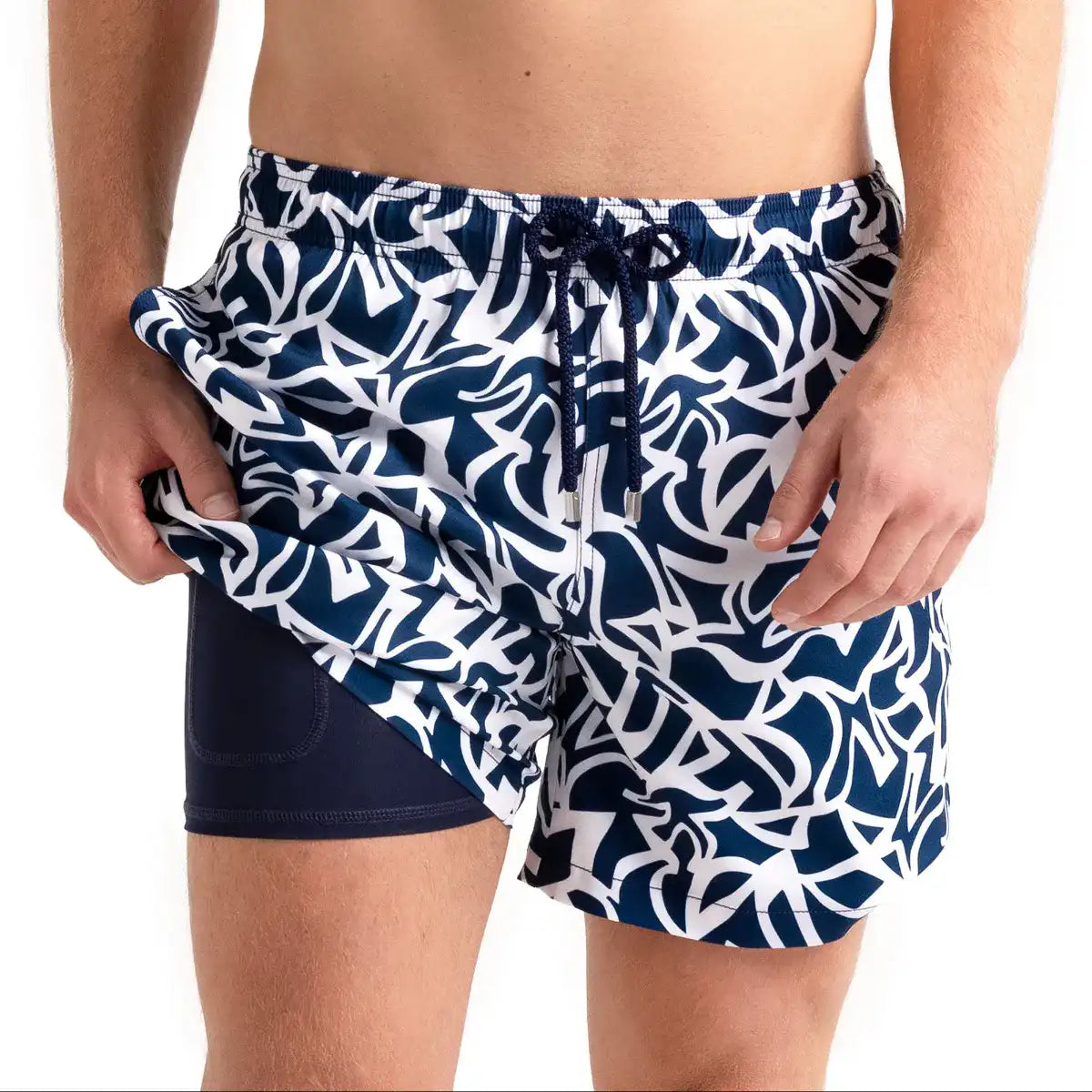 Blue Freedom men's hybrid swim short, navy and white abstract floral print, front view showing the navy compression liner