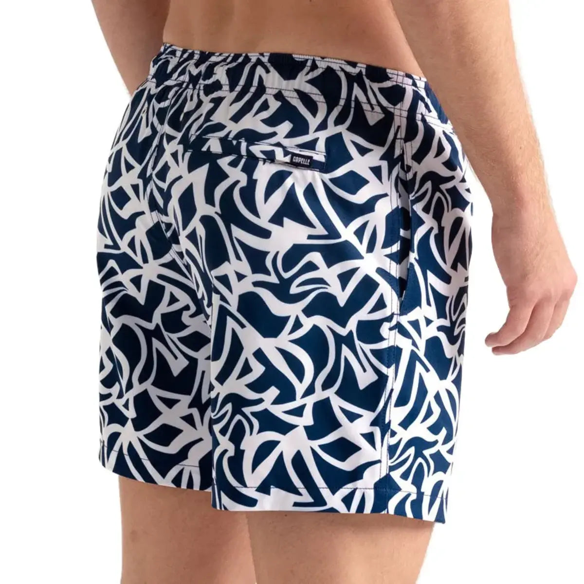 Blue Freedom men's hybrid swim short in a navy and white abstract floral print, back view