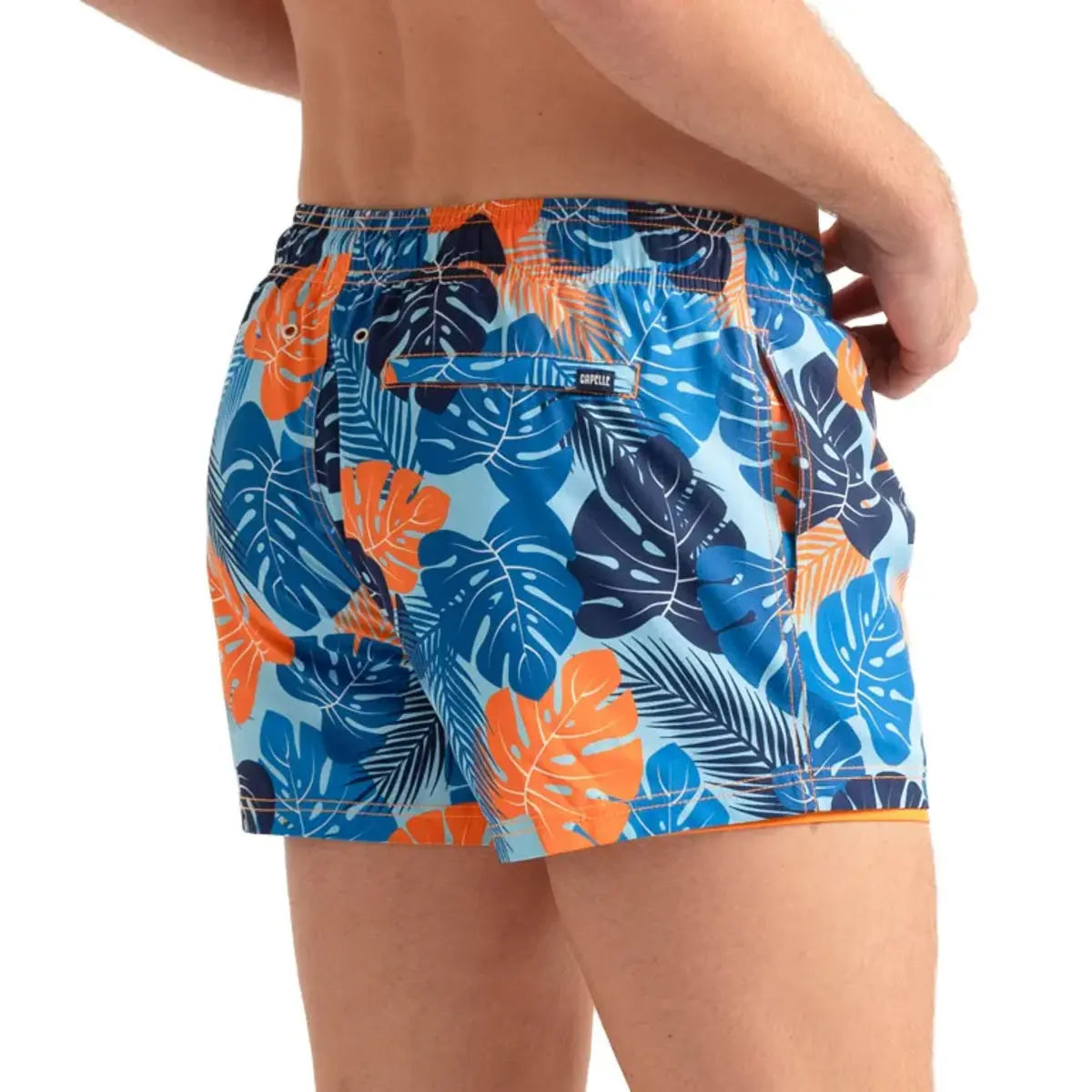 Blue Jungle men's hybrid swim short in the 3 inch Short, blue and orange tropical leaf print, back view