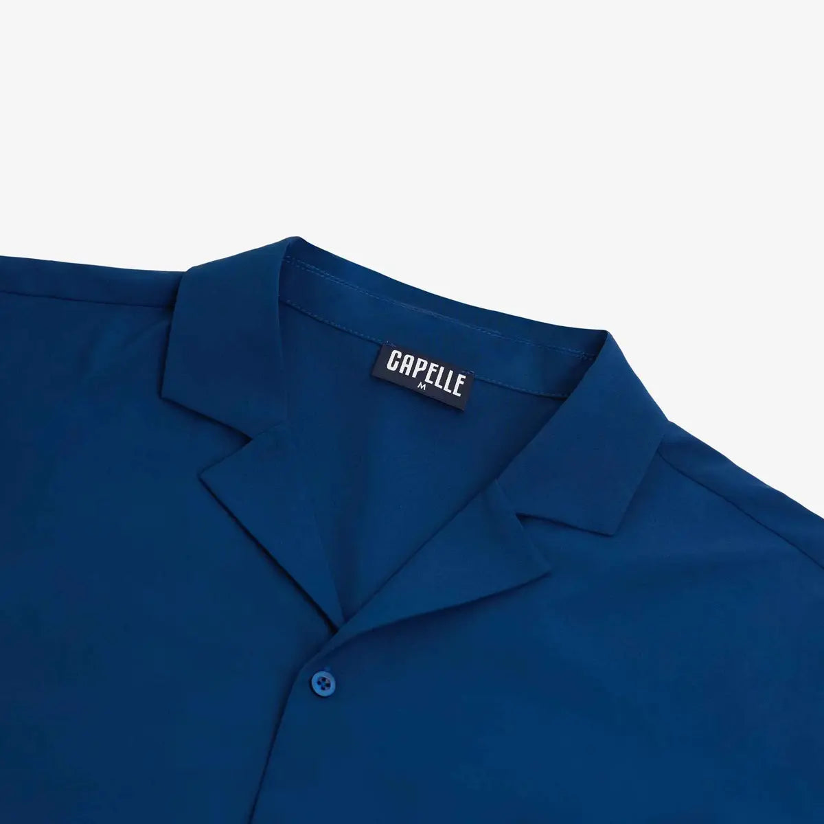 Close-up of the Blue Sapphire resort shirt fabric and button placket in royal blue