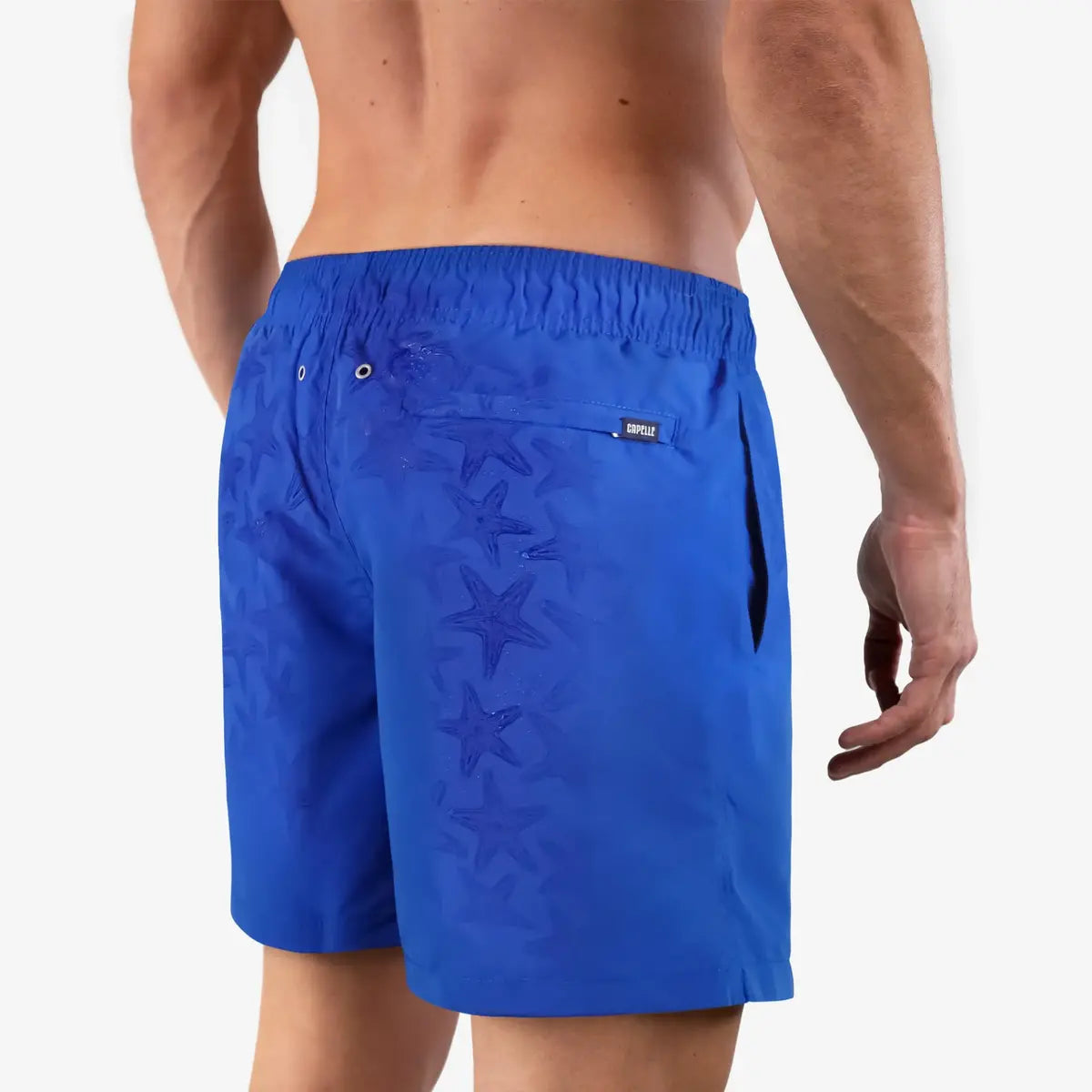 Magic Blue Stars men's water reactive hybrid swim short in royal blue, back view