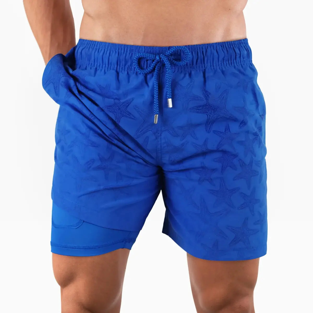 Magic Blue Stars men's water reactive hybrid swim short in royal blue, the starfish print hidden until it gets wet, front view