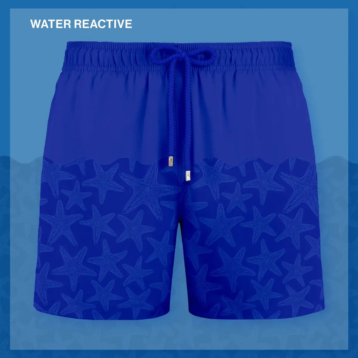 Magic Blue Stars hybrid swim short shown half wet, the hidden starfish print appearing where the water hits