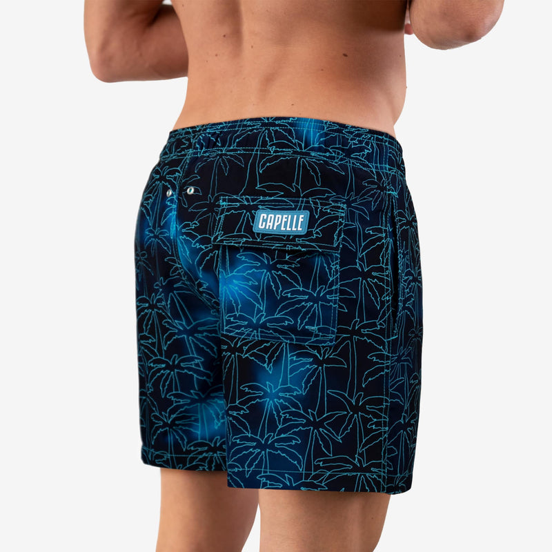 Foggy Palms men's hybrid swim short in navy with a turquoise palm print, back view