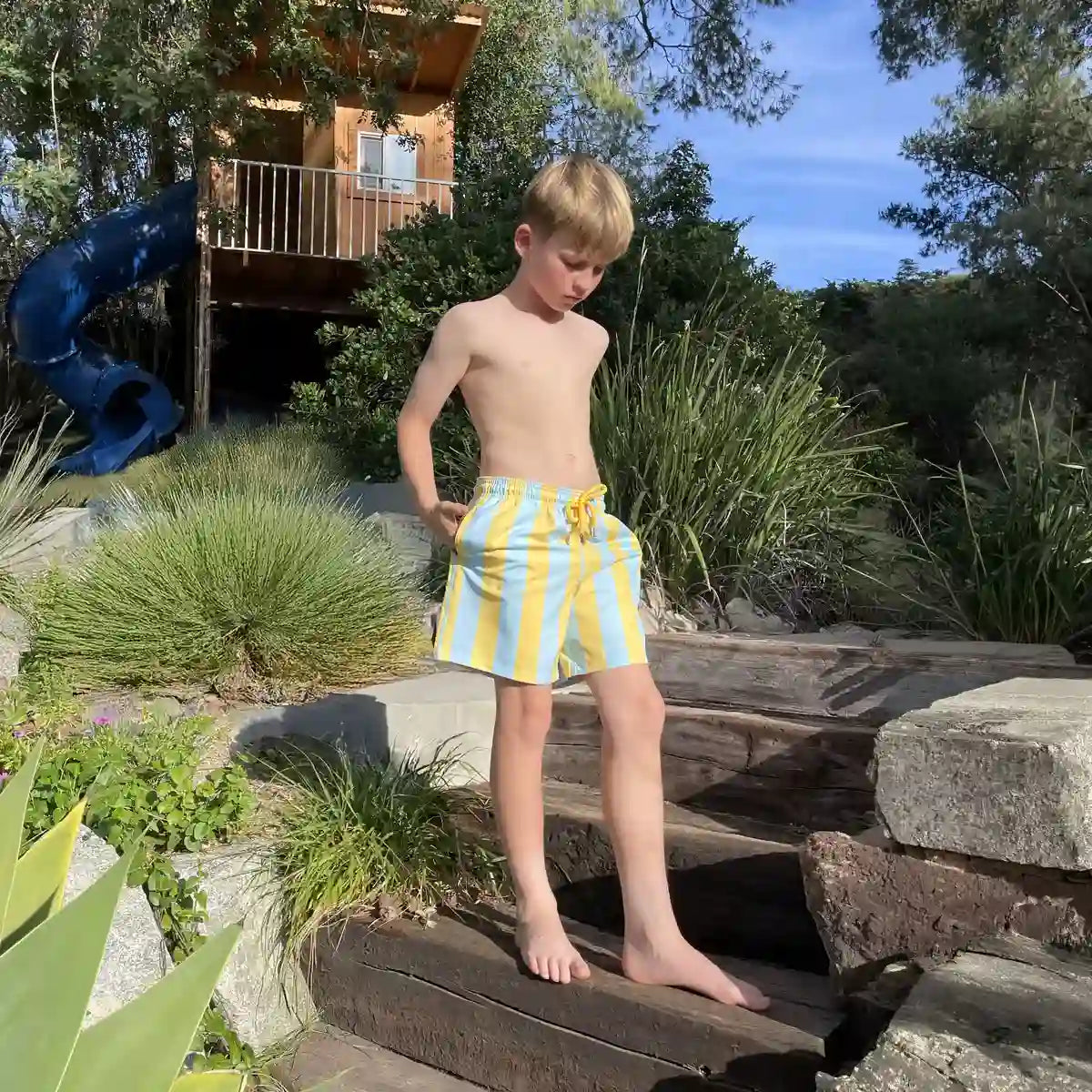 Coastal Cabana, Sun and Sky boys hybrid short, worn on model
