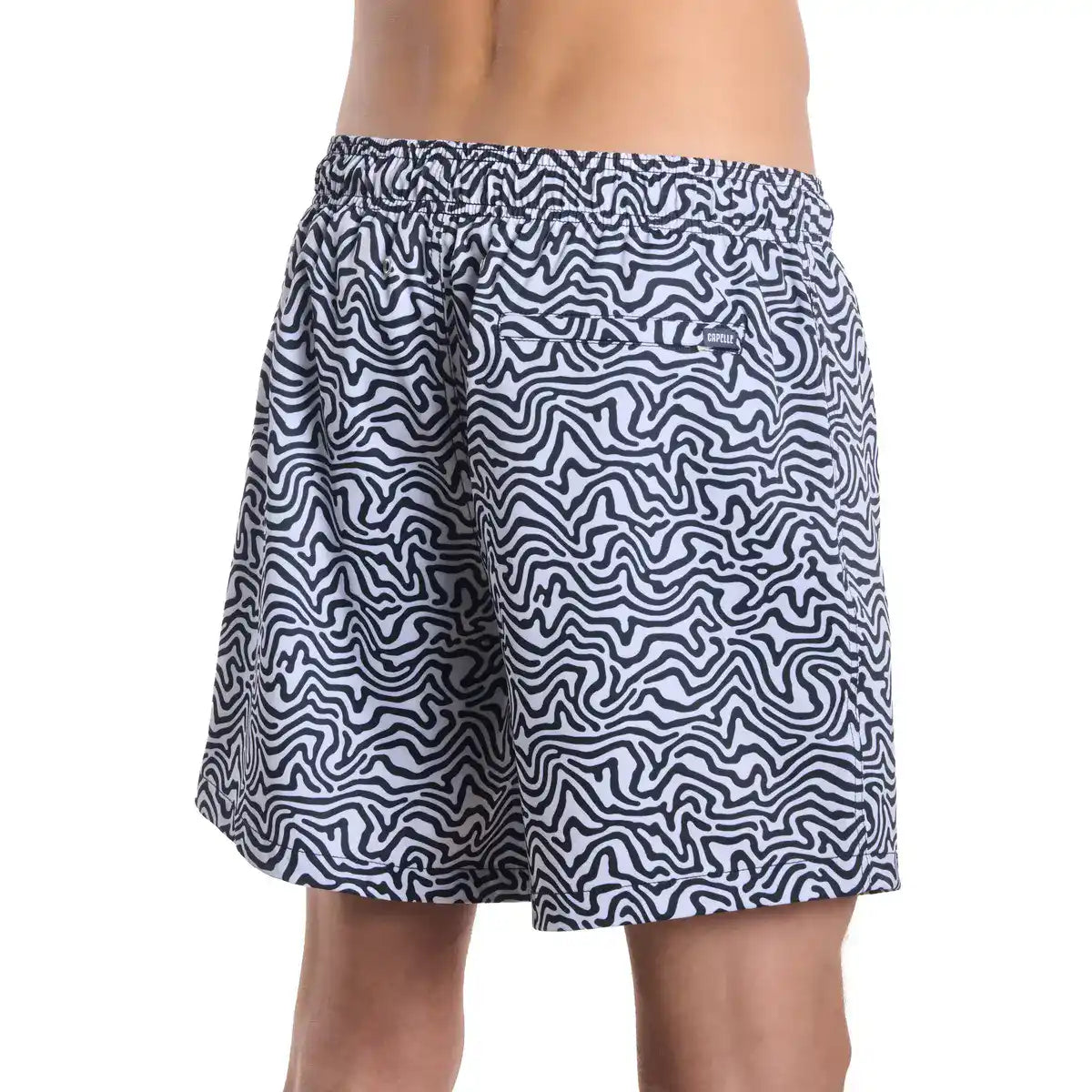 Deco Maze, Surf and Storm men's hybrid swim short in a black and white swirled maze print, back view