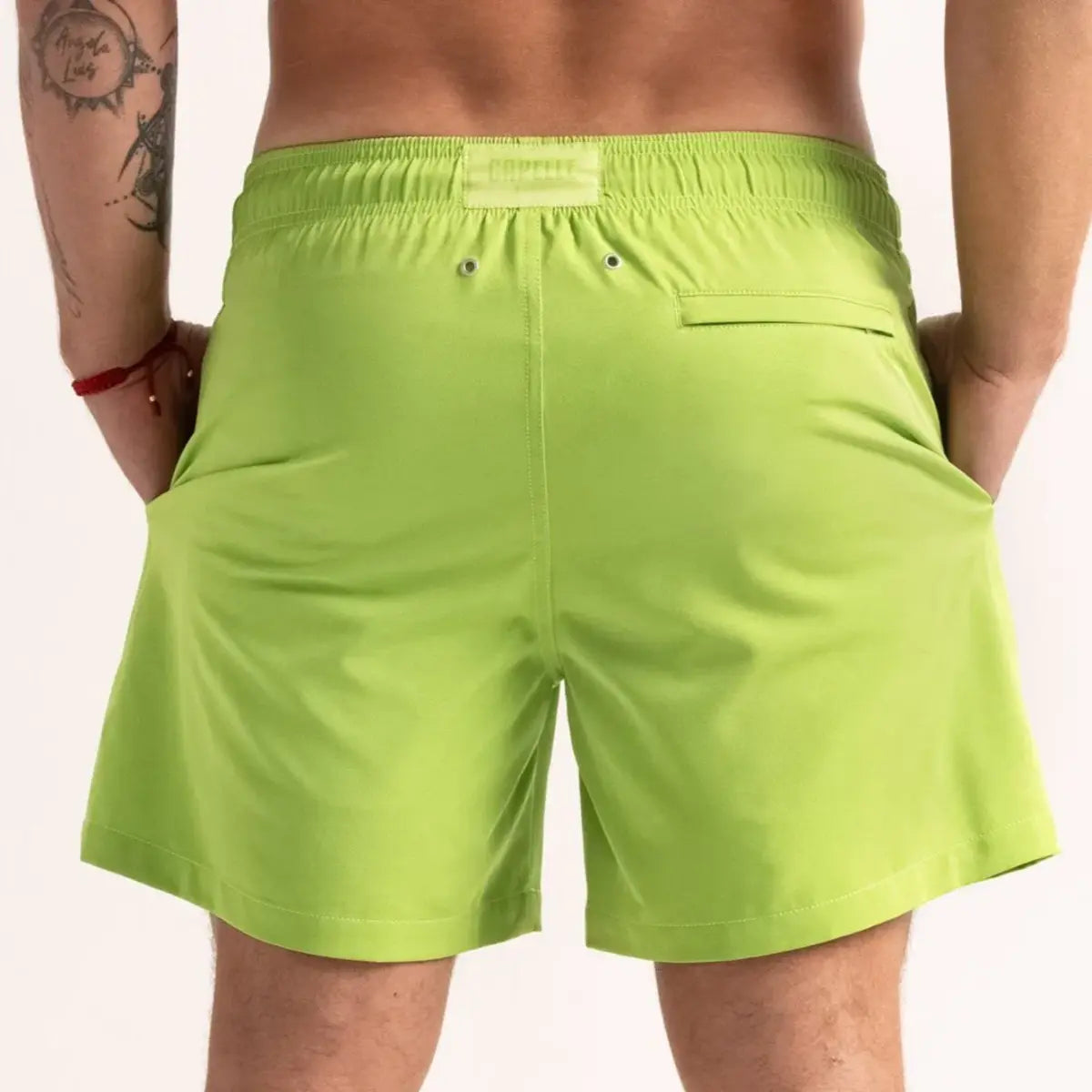 Magic Green Captive men's water reactive hybrid swim short in lime green, back view