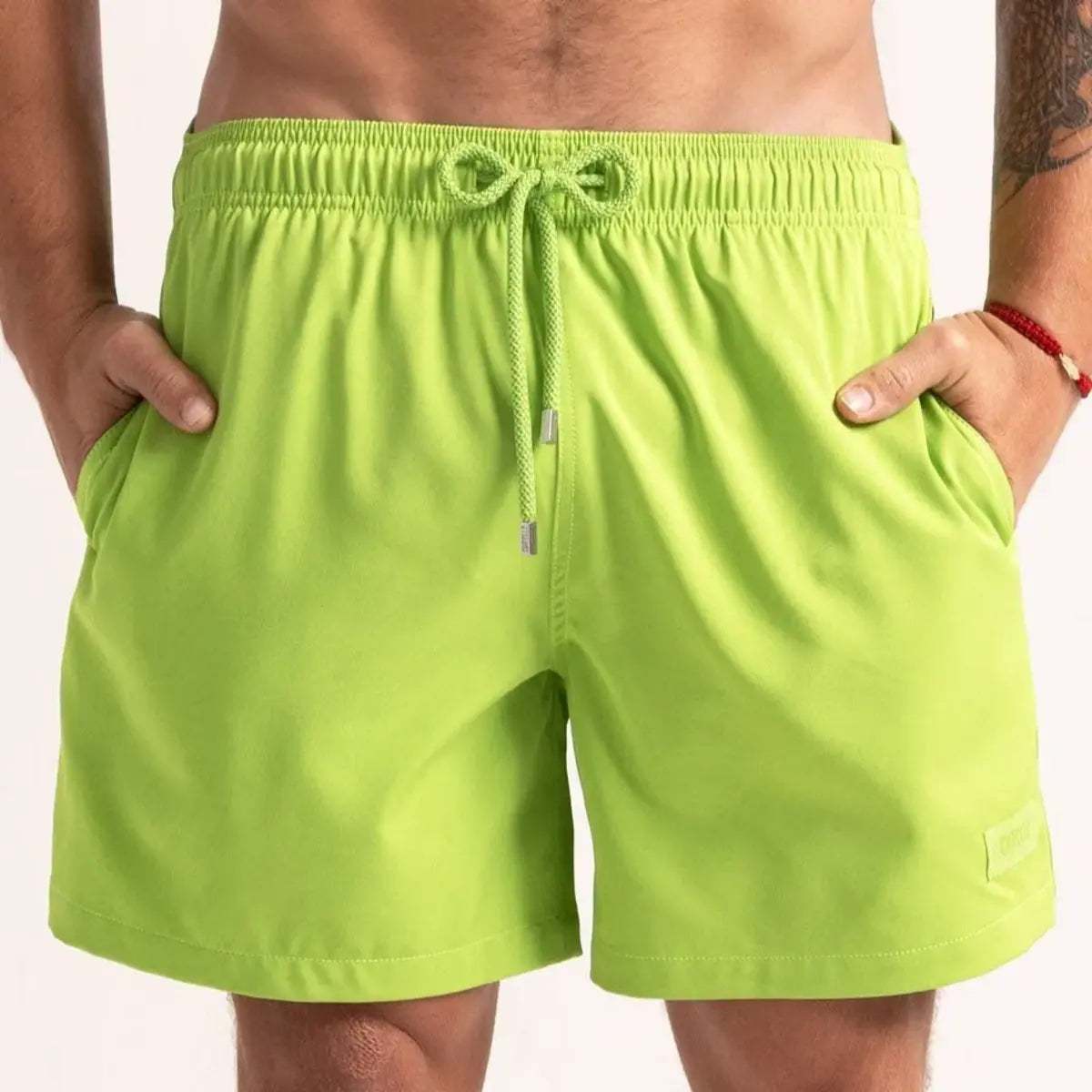 Magic Green Captive men's water reactive hybrid swim short in lime green, front view, second angle