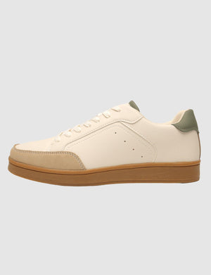 G West men's beige sneaker with a perforated toe and gum sole, inner side view