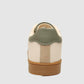 G West men's beige sneaker, back view of the sage green heel tab and gum sole