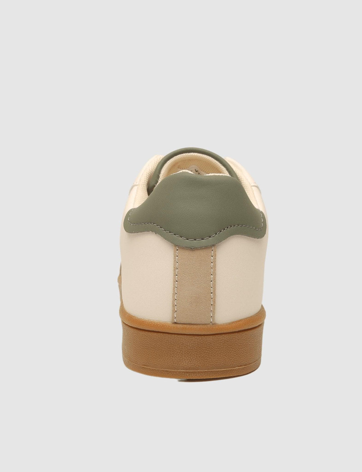 G West men's beige sneaker, back view of the sage green heel tab and gum sole