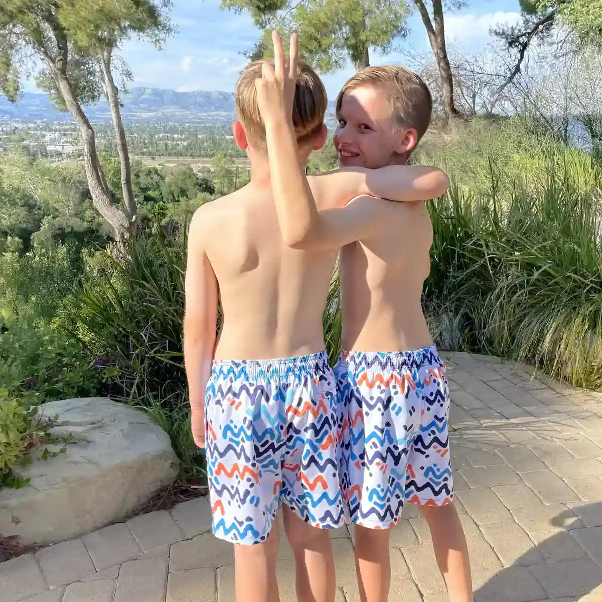Line Rush, Ocean and Sol boys hybrid short, worn on model