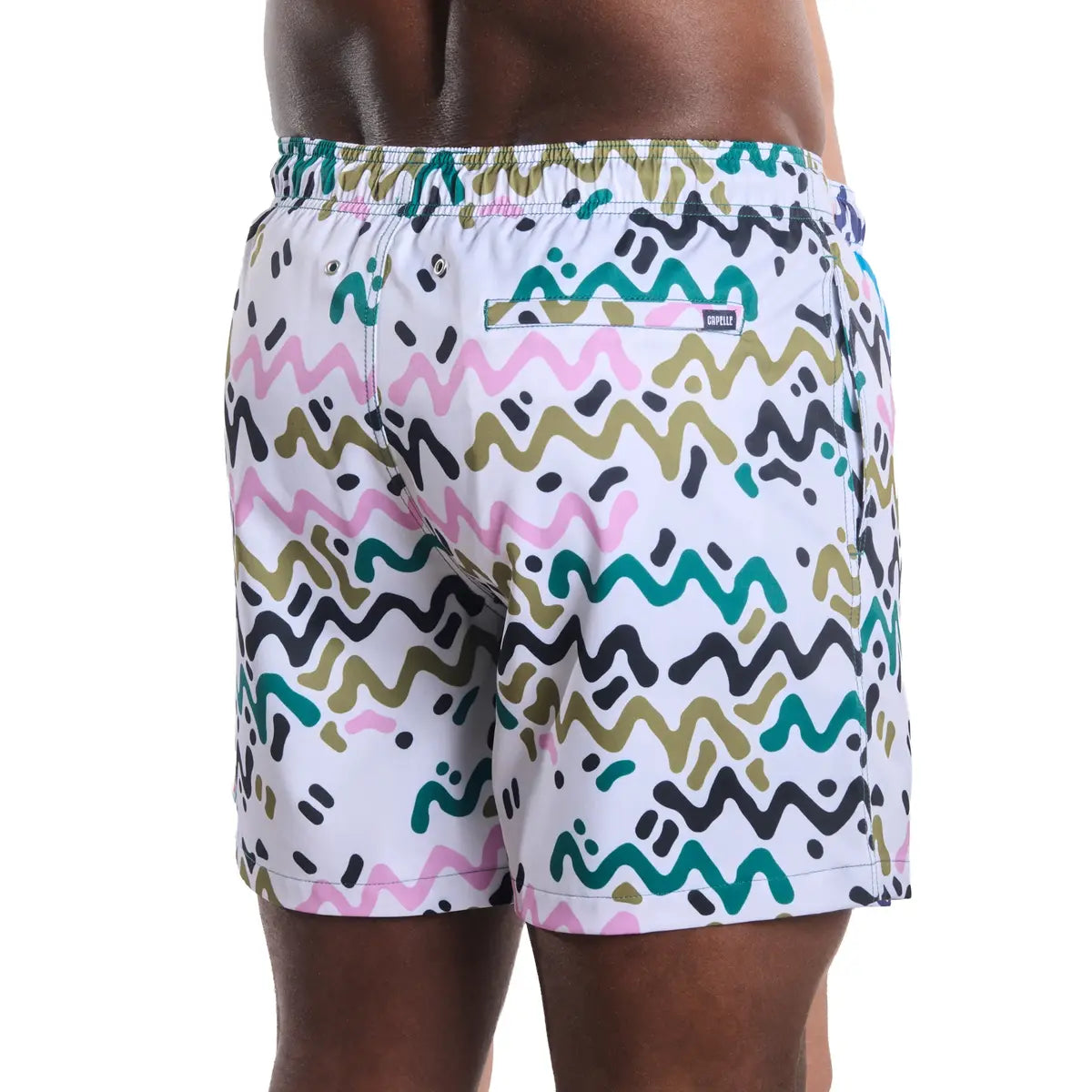 Line Rush, Orchid and Kelp men's hybrid swim short in a white, green, olive and pink zigzag print, back view