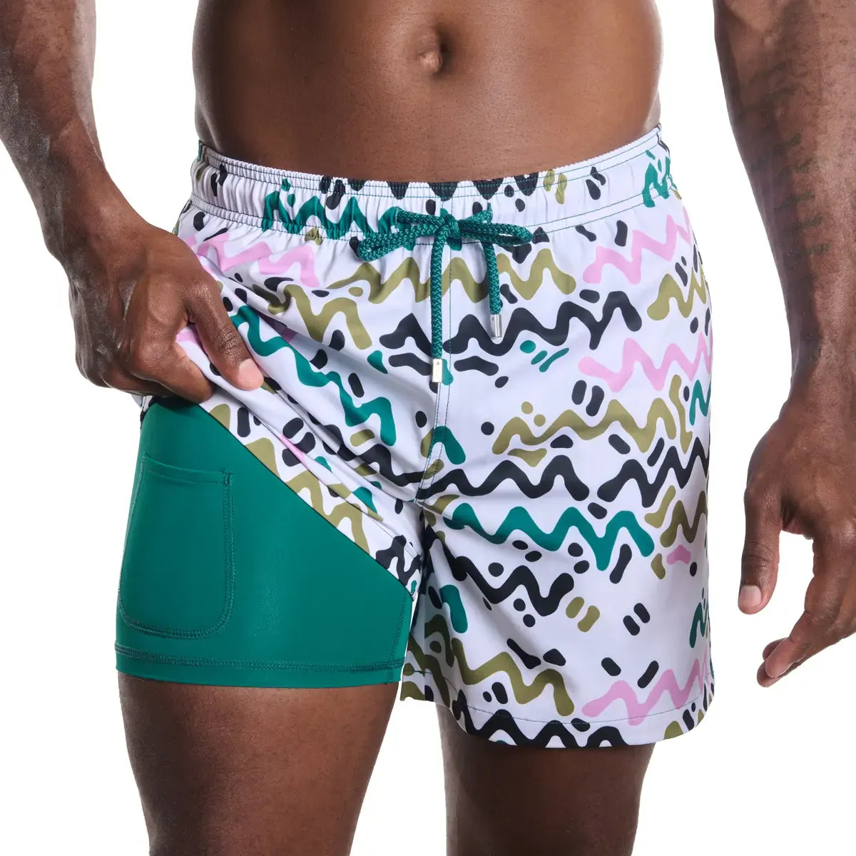 Line Rush, Orchid and Kelp men's hybrid swim short, white with a green, olive, pink and charcoal zigzag print and green drawstring, front view showing the green compression liner