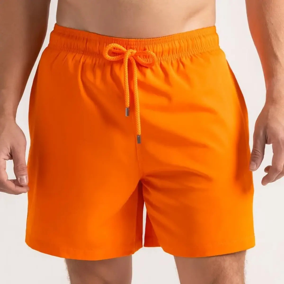 Orange Soda men's hybrid swim short in solid bright orange, front view, second angle