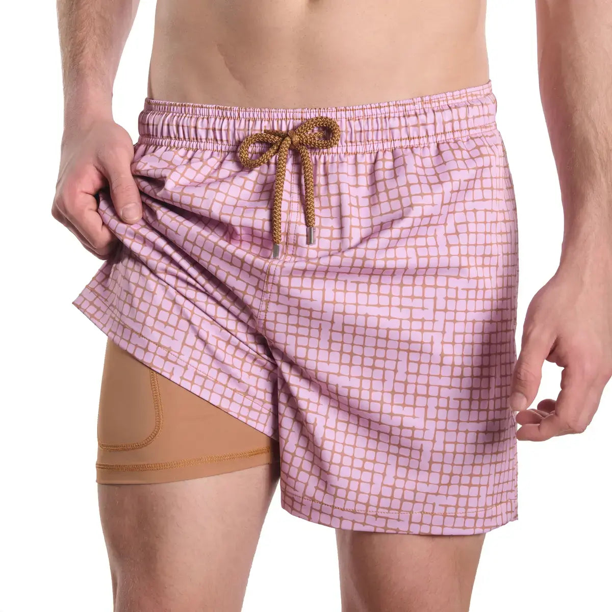 Pixel Break, Rosetide men's hybrid swim short, dusty pink with a tonal pixel grid check and tan drawstring, front view showing the tan compression liner