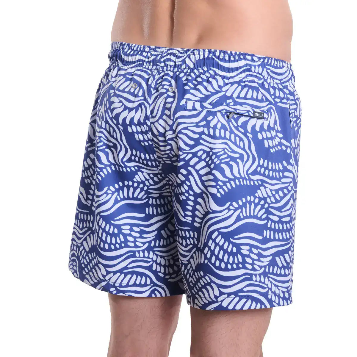 Salt Spray, Harbor and Surf men's hybrid swim short in indigo with a white coral reef print, back view