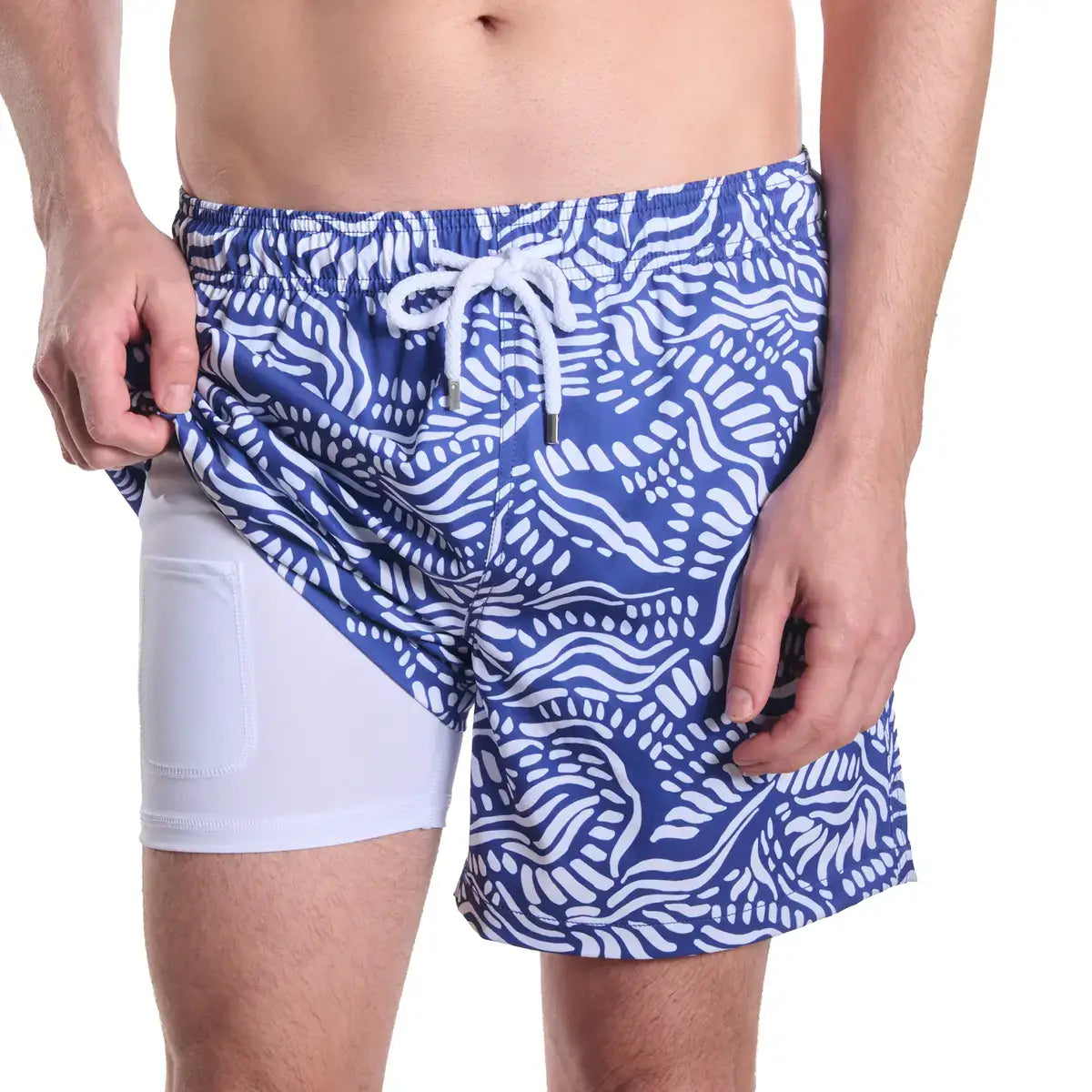 Salt Spray, Harbor and Surf men's hybrid swim short, indigo blue with a white coral reef print, front view showing the white compression liner